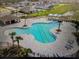 Aerial view of the community pool and lounge area surrounded by homes at 4373 Deleon St, Haines City, FL 33844