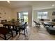Comfortable dining and living area with ample natural light and access to the backyard at 4373 Deleon St, Haines City, FL 33844