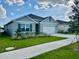 A charming single-story house boasts a well-kept lawn and a practical two-car garage at 4373 Deleon St, Haines City, FL 33844