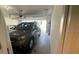 Spacious garage with an open door to the driveway and vehicle at 4373 Deleon St, Haines City, FL 33844