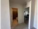 Hallway area showcasing access to a well-lit bathroom and a cozy bedroom at 4373 Deleon St, Haines City, FL 33844