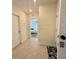 Hallway with tiled floors leading to a bedroom at 4373 Deleon St, Haines City, FL 33844