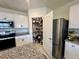 Bright kitchen with stainless steel appliances, a pantry, and granite countertops at 4373 Deleon St, Haines City, FL 33844