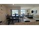 Open concept dining and living area with lots of natural light and comfortable furniture at 4373 Deleon St, Haines City, FL 33844