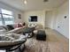Comfortable living room with a plush couch, modern furniture, and lots of natural light at 4373 Deleon St, Haines City, FL 33844