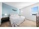 Inviting bedroom with a queen-size bed, soft lighting, and an accent wall at 438 Marcello Blvd, Kissimmee, FL 34746