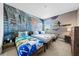 Whimsical ' bedroom with three twin beds, a Hogsmeade mural, and fun Harry Potter themed decor at 438 Marcello Blvd, Kissimmee, FL 34746