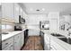 Beautiful kitchen featuring white cabinets, modern appliances, and an abundance of counter space at 438 Marcello Blvd, Kissimmee, FL 34746
