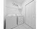 Clean and organized laundry room with a washer, dryer, wire shelving, and ample closet space at 438 Marcello Blvd, Kissimmee, FL 34746