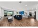 Bright and airy living room seamlessly connects to the kitchen, ideal for modern living at 438 Marcello Blvd, Kissimmee, FL 34746