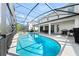 A screened in pool and patio provide a relaxing outdoor space at 438 Marcello Blvd, Kissimmee, FL 34746