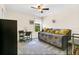 Cozy bedroom with ceiling fan, work desk, and a comfortable daybed adorned with decorative pillows at 4542 Cypress Cay Way, Kissimmee, FL 34746