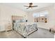 Inviting bedroom with a plush bed, bedside table, and a window offering natural light at 4542 Cypress Cay Way, Kissimmee, FL 34746