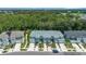 Exterior view of newly constructed townhomes, featuring individual driveways and modern architectural details at 4542 Cypress Cay Way, Kissimmee, FL 34746