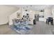 Bright open concept kitchen with stainless steel appliances, hardwood floors, breakfast bar, and an eat-in dining area at 4542 Cypress Cay Way, Kissimmee, FL 34746
