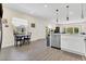 Spacious kitchen with stainless steel appliances, hardwood floors, an eat-in dining area, and lots of natural light at 4542 Cypress Cay Way, Kissimmee, FL 34746