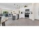 Open concept kitchen with stainless steel appliances, hardwood floors, recessed lighting, and an eat-in dining area at 4542 Cypress Cay Way, Kissimmee, FL 34746