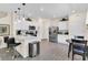 Bright kitchen with stainless steel appliances, hardwood floors, breakfast bar, and an eat-in dining area at 4542 Cypress Cay Way, Kissimmee, FL 34746