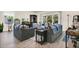 Comfortable living room with modern furnishings, hardwood floors, sliding glass doors to the outside, and tasteful decor at 4542 Cypress Cay Way, Kissimmee, FL 34746