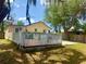Charming backyard view with a large white fenced deck, perfect for relaxing outdoors at 455 E Palmetto Ave, Longwood, FL 32750
