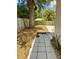 Backyard featuring a tree, block-paved walkway, and wood fence at 455 E Palmetto Ave, Longwood, FL 32750