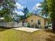 Expansive backyard with a deck and a patio, offering ample space for outdoor activities at 455 E Palmetto Ave, Longwood, FL 32750