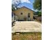 A brick backyard offers a private space for relaxation and entertaining at 455 E Palmetto Ave, Longwood, FL 32750