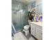 Bathroom featuring a glass-enclosed shower, white vanity, and built in storage at 455 E Palmetto Ave, Longwood, FL 32750