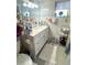 Well-lit bathroom with stylish vanity, marble countertop, and mosaic tile accents at 455 E Palmetto Ave, Longwood, FL 32750