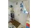 Cozy entryway featuring a white door, decorative shelves, and a patterned rug for a welcoming touch at 455 E Palmetto Ave, Longwood, FL 32750