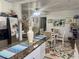 Open-concept kitchen and dining area with modern appliances, ample counter space, and stylish decor at 455 E Palmetto Ave, Longwood, FL 32750