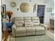 The living room boasts a comfortable seating arrangement, wall art, and a view to the Primary bedroom at 455 E Palmetto Ave, Longwood, FL 32750
