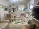 Open concept living and dining room showcasing an eat-in kitchen and a dining table for four people at 455 E Palmetto Ave, Longwood, FL 32750