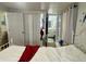 Bright and cozy bedroom offers privacy and functionality, enhanced by natural light and views to the bathroom at 455 E Palmetto Ave, Longwood, FL 32750