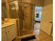 Ensuite bathroom featuring tile and glass shower, sink, and neutral colors at 501 Mirasol Cir # 203, Celebration, FL 34747