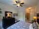 Bright bedroom featuring ceiling fan and view into Primary bath at 501 Mirasol Cir # 203, Celebration, FL 34747