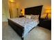 Well-lit bedroom featuring dark furnishings, comfortable bed and ample space at 501 Mirasol Cir # 203, Celebration, FL 34747