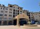 Beautiful multi-story building featuring a water fountain and elegant entrance at 501 Mirasol Cir # 203, Celebration, FL 34747