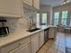 Stylish kitchen with white countertops, stainless steel sink, and modern cabinetry at 501 Mirasol Cir # 203, Celebration, FL 34747