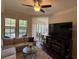 Inviting living room area with large windows, neutral furnishings, and an adjacent dining area at 501 Mirasol Cir # 203, Celebration, FL 34747