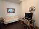 Home office space with a comfy sofa, stylish desk, and elegant decor at 501 Mirasol Cir # 203, Celebration, FL 34747