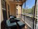 Relaxing screened-in patio with wicker furniture and views of the community at 501 Mirasol Cir # 203, Celebration, FL 34747