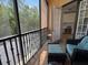 Inviting screened-in patio with tile flooring and comfortable wicker seating at 501 Mirasol Cir # 203, Celebration, FL 34747