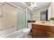 Clean bathroom featuring tiled shower, single vanity, and ample lighting at 5053 Maui Cir # 14, Orlando, FL 32808