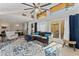 Bright and airy living space with high ceilings, a fireplace, and seamless transition to outdoor dining at 5053 Maui Cir # 14, Orlando, FL 32808