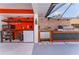 Outdoor kitchen and bar area with cabinets, grill, microwave, refrigerator and sink at 5053 Maui Cir # 14, Orlando, FL 32808
