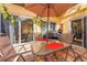 Patio featuring an outdoor dining table and a grill under an umbrella at 5053 Maui Cir # 14, Orlando, FL 32808