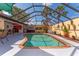 The screened-in pool area with a pool and outdoor bar area at 5053 Maui Cir # 14, Orlando, FL 32808