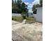 View of the backyard with a small storage shed, privacy fence, and sparse lawn at 5562 Old Tampa Hwy, Davenport, FL 33896