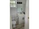 Bathroom features a standard toilet, vanity, and mirror with bright lighting at 5562 Old Tampa Hwy, Davenport, FL 33896